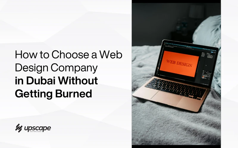 Graphic banner showing a laptop with “WEB DESIGN” on screen beside text about choosing a Dubai web design company without getting burned; Upscape logo.